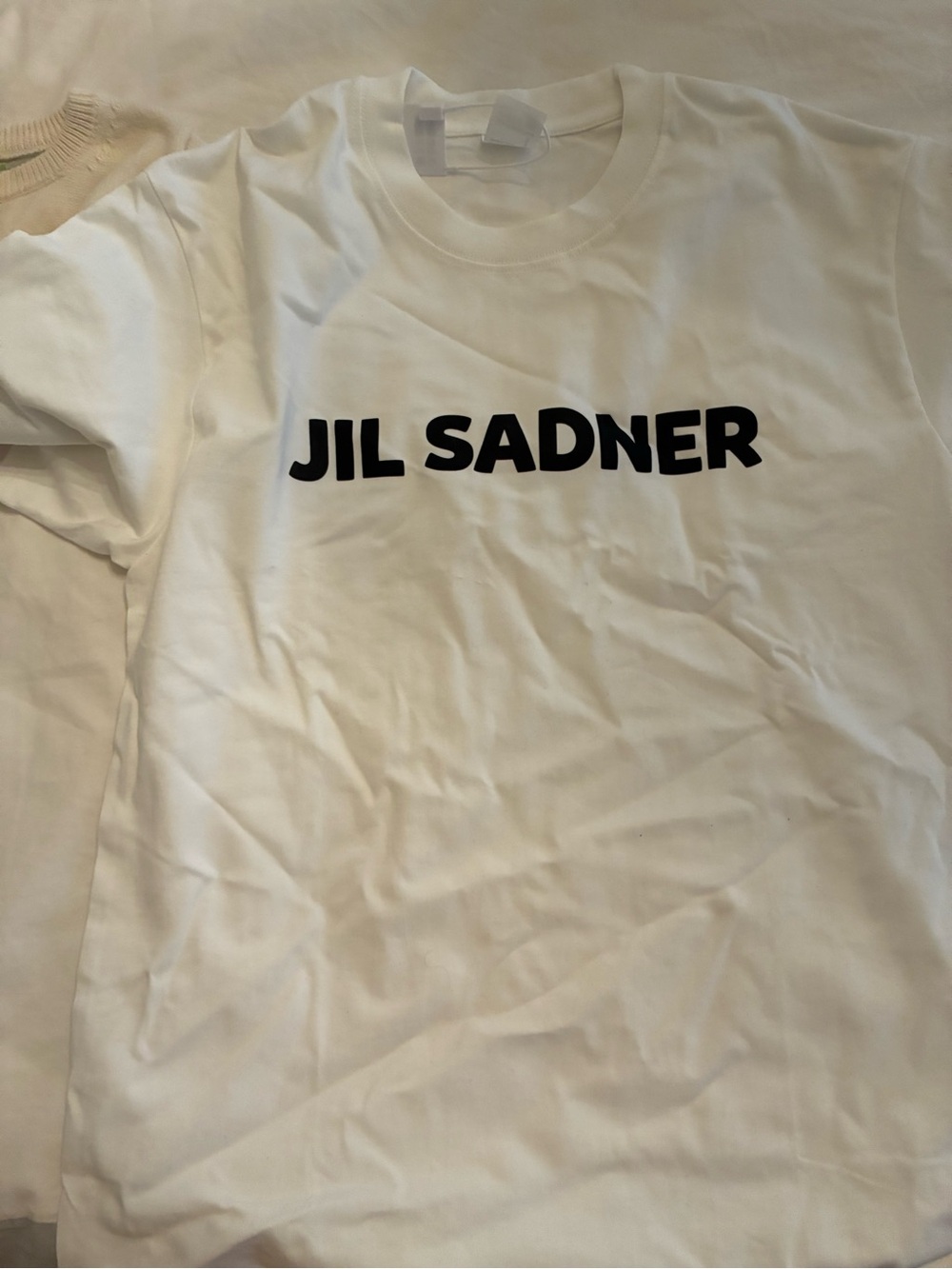 White Graphic Tee with Bold Black Text